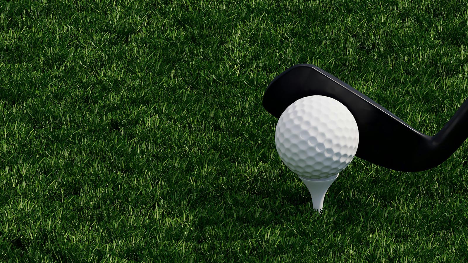 golf-ball-and-club-on-green